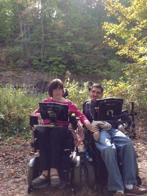 Kate and Dave Posing for a picture in the woods. 